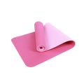 Pink yoga mat rolled up on a white background