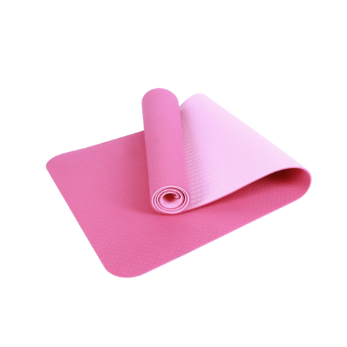 Pink yoga mat rolled up on a white background