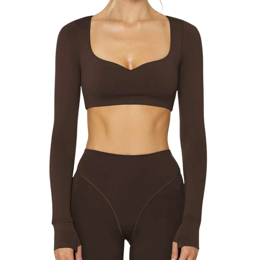 Brown long-sleeve crop top and high-waisted leggings set on a white background