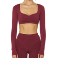 Maroon long-sleeve athletic top and leggings set on a white background