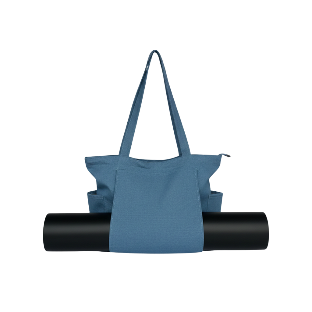 denim tote bag with a black yoga mat on a white background