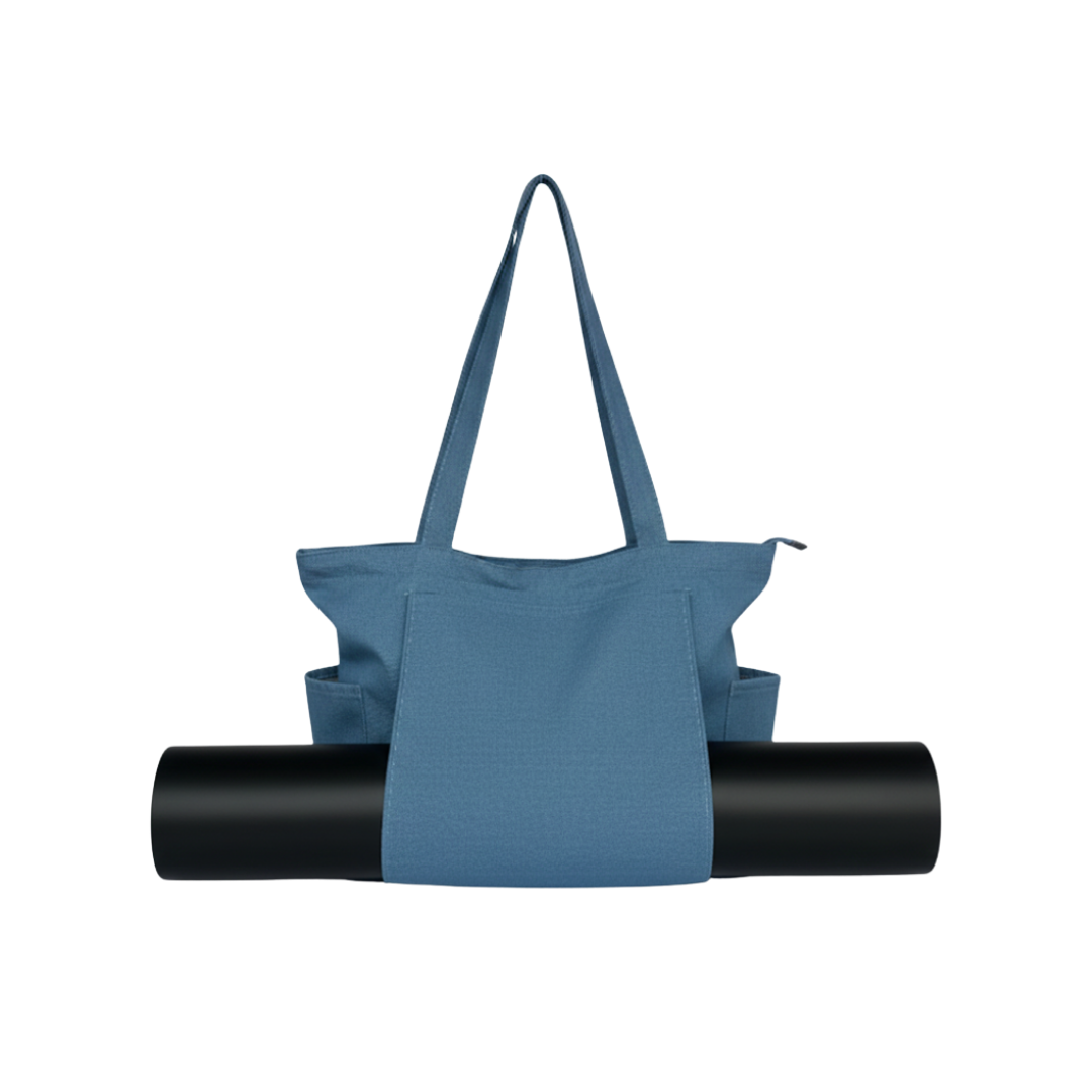 denim tote bag with a black yoga mat on a white background