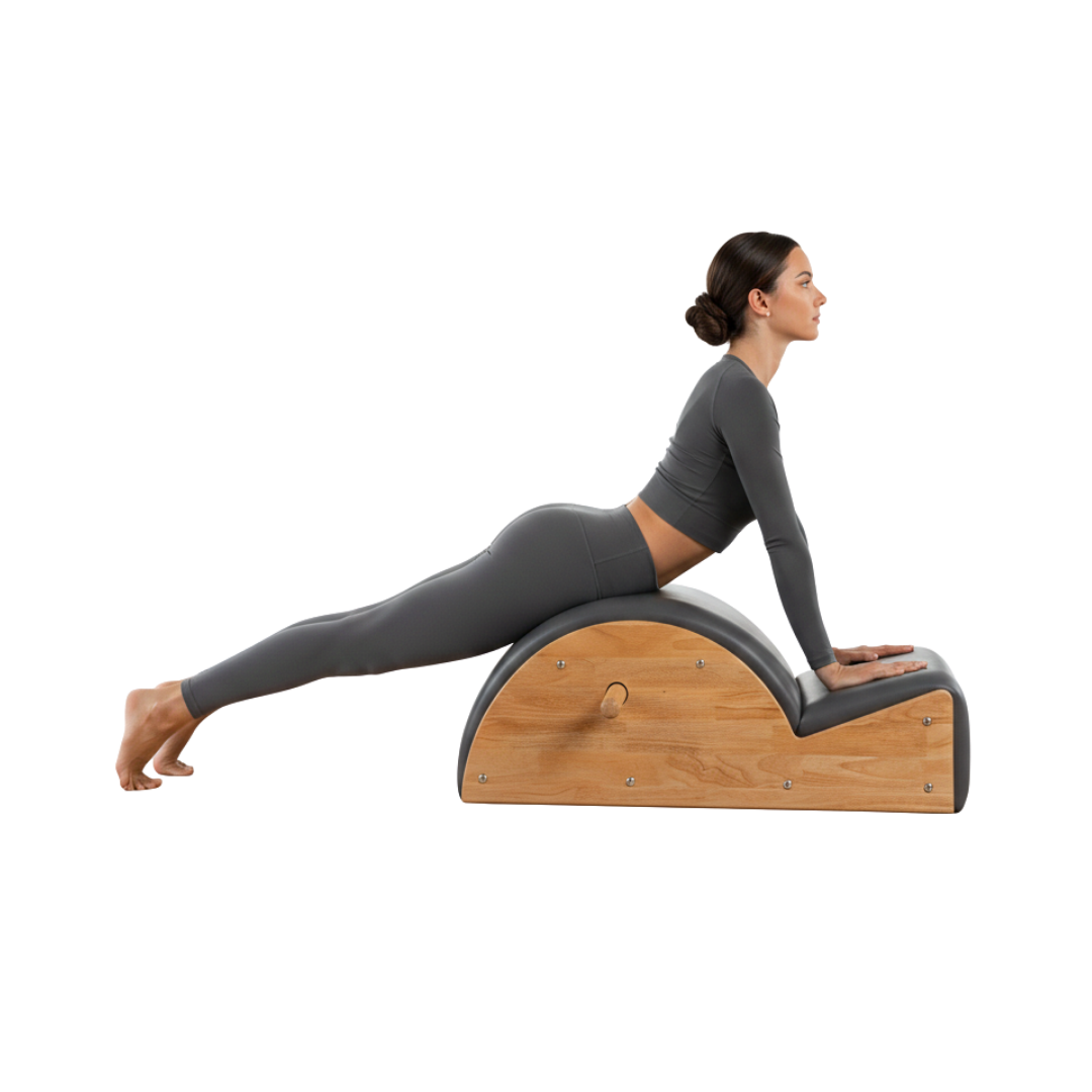 Woman using a wooden exercise wedge on a white background