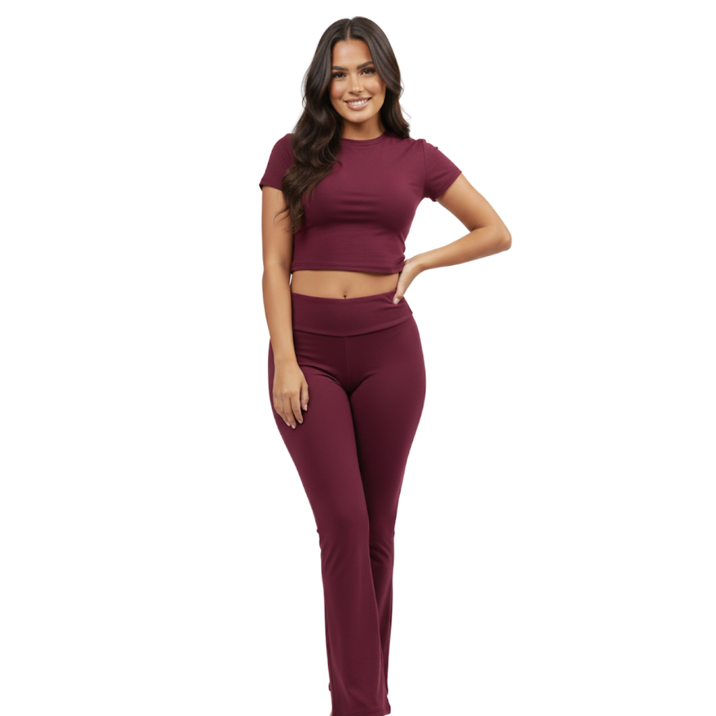 Woman wearing a maroon outfit on a white background